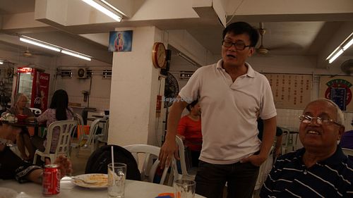 Mr Chung giving suggestion on food. at Blue Boy Vegetarian Food Centre in Kuala Lumpur