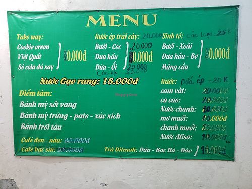 Menu posted on the wall by the entrance at Tu Hao in Hanoi
