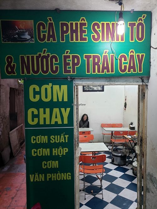 The restaurant with the proprietor. She doesn't speak English but she is friendly and has a warm smile. at Tu Hao in Hanoi