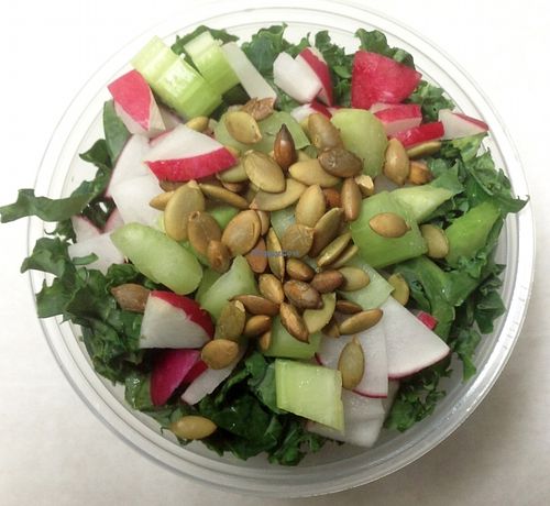Shredded kale salad with celery, red radish and roasted pumpkin seeds. Served with a creamy seed  & scallion dressing. at 7th Element in Burbank