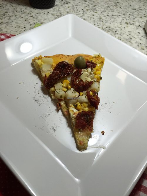 ''Bella vegana'': tofupiry (cheese), corn, palm heart, mushroom, peas, dried tomato. at Bella Mooca Pizzaria in Sao Paulo