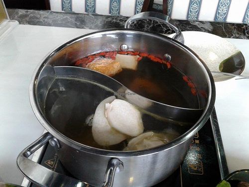 2 choice of different flavour of soup in a pot at Yummy Veggie in East Singapore