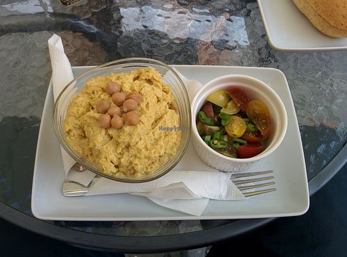 Hummus with tomato salsa. Delicious hummus with a dash of turmeric at BIOFresh in Timisoara