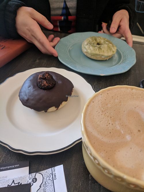 Chocolate truffle donut, matcha donut and an oat milk latte at Fat Cats in Austin