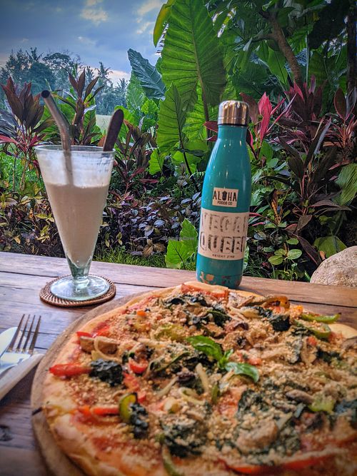 Vegan pizza, raspberry coconut mylkshake and the view! at Atman Kafe in Ubud