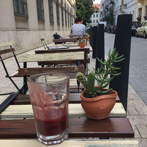 Tables on the other side of the street. Very cute! at CsendesM Vegan Bistro in Budapest