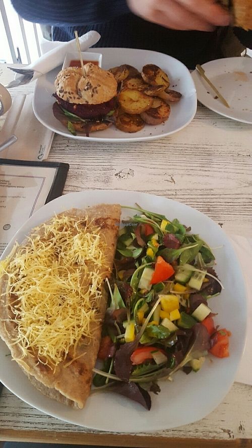 Burger with baked patatoes and buckwheat crêpe with spinach and cheese with salad   at CsendesM Vegan Bistro in Budapest