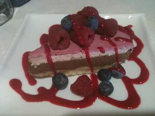 Chocolate Pie w/ Vanilla and berry sauce!  Yummy!!! at Rawtopia Living Cuisine and Beyond in Millcreek