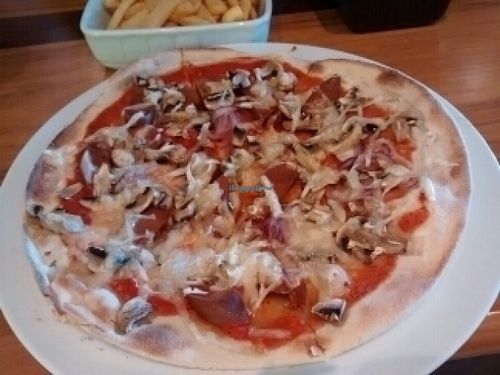 vegan pizza - mushroom instead of cucumber for me!  at Coco Cafe Club & Restaurant in Gdynia