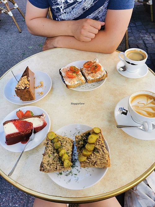 Breakfast sandwiches with vegan pate and pickles, cappuccino with oat milk, vegan nutella cheesecake and vegan cheesecake with strawberry and raspberry mousse. Amazing! at Retro in Gdansk