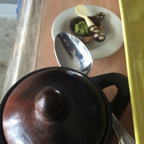 Chickpea dish in cute pot and spicy sauce at Queen of Sheeba in West Palm Beach