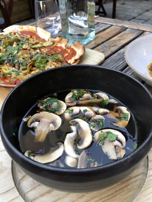 Mushroom soup and vegan flatbread at TIAN Bistro am Spittelberg in Vienna