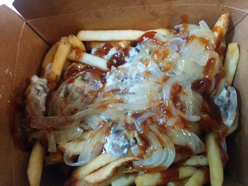 Loaded shroom fries; fried topped with sauteed mushrooms and onions in a smokey BarBQ cheesy sauce. at VeganBurg in San Francisco