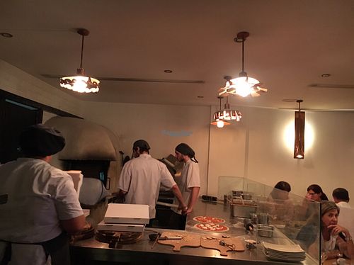 making the pizzas  at In Bocca Al Lupo in Lisbon