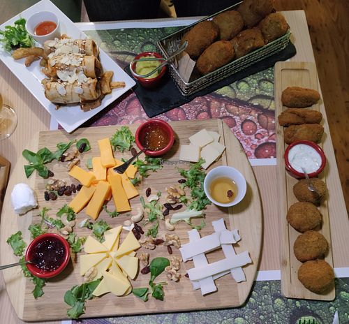So much food!! Vegan cheese board, jumbo artichoke croquettes, spinach and mushroom croquettes, and faux duck spring rolls. at Crock and cock in Bilbao