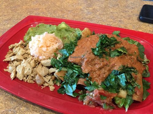 Crispy flautas smothered by toppings of vegan chicken and delicious chipotle sauce. at La Blue Casa in Arlington
