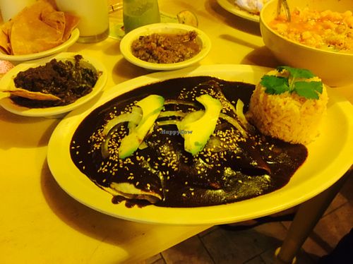 vegan chicken mole enchiladas were very delicious not spicy though, the sauce was very flavorful and good to dip with chips and beans! at Las Delicias Fonda Vegana y Vegetariana  in Cancun