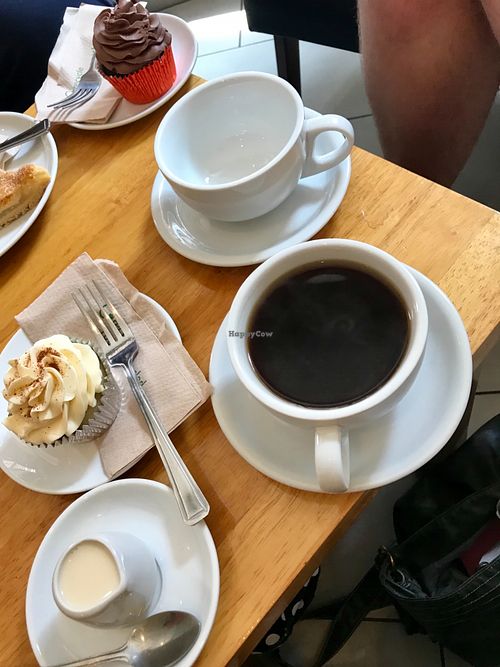 Americano with oat milk, vegan chai cupcake plus a vegan chocolate cupcake. at Cafe Mbriki in Leicester