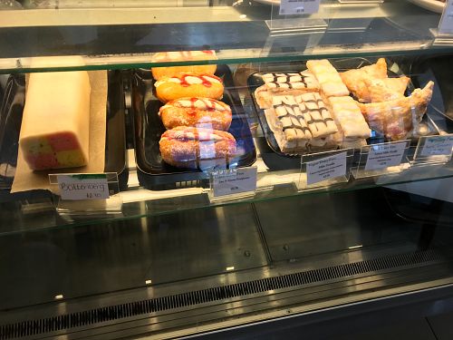 Full row of fresh vegan cakes including Battenberg cake! There were also vegan cupcakes ontop of the counter and a vegan chocolate/coconut slice!  at Cafe Mbriki in Leicester