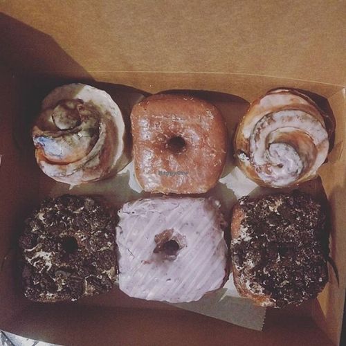 TOP L-R: cinnamon roll, regular glazed, cinnamon roll // BOTTOM L-R: PB Oreo, Blueberry, PB Oreo at Valhalla Bakery in Orlando