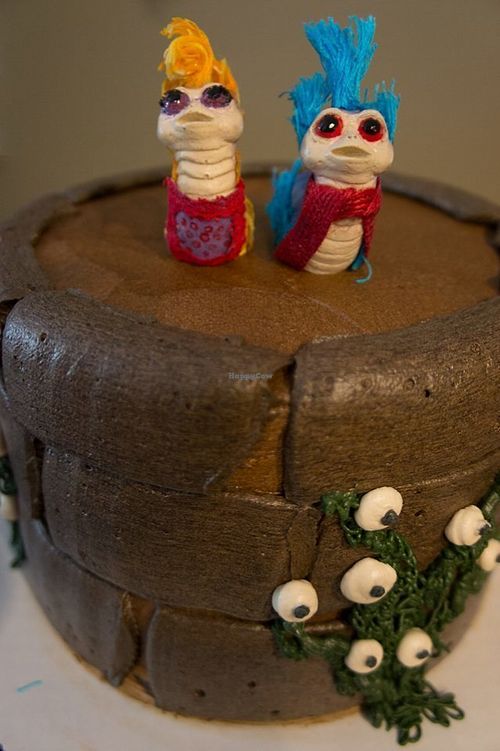 Our amazing and delicious vegan wedding cake from Valhalla. It’s chocolate cake, layer of salted caramel buttercream, layer of chocolate chip cookie dough and chocolate frosting!  at Valhalla Bakery in Orlando