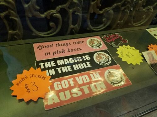 bumper stickers at Voodoo Doughnuts - E 6th St in Austin