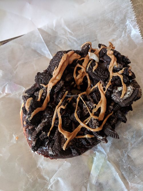 Vegan Old Dirty Bastard - Chocolate glaze with oreos and peanut butter drizzle at Voodoo Doughnuts - E 6th St in Austin