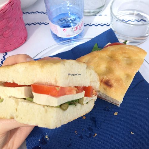 focaccia with tofu, tomato, capers and rocket  at H2O Juice Bar & Vegan Cafe in Fuerteventura