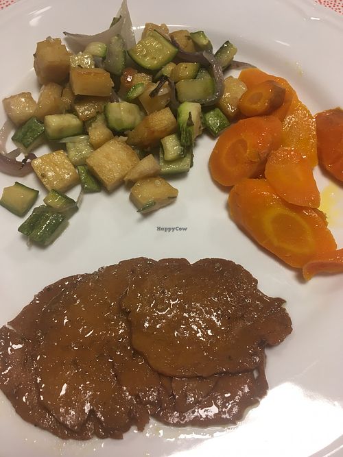 Seitan roast, sautéed carrots and courgettes, and diced farinata  at Il Cardo e l'Ortica in Mondovi