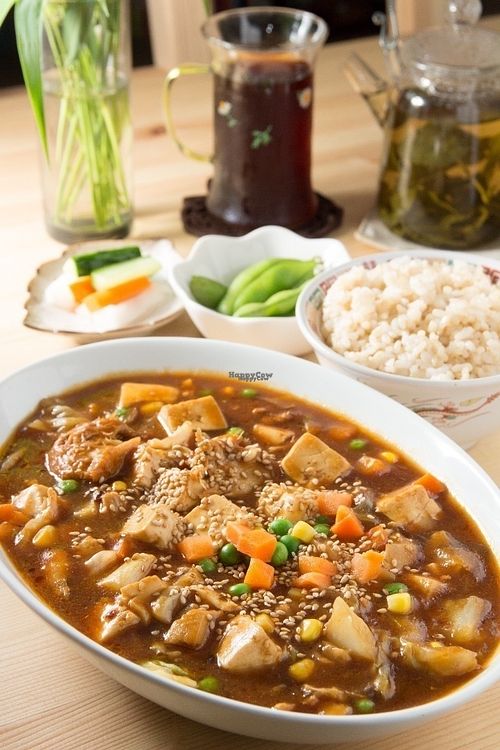 Mar Po Tofu Set, consisting of Tofu, Yamabushi Take (Monkey head Mushrooms) fresh vegetables cooked with healthy spices and black miso. White or brown rice, fresh Soya beans and pickled vegetables. A choice of coffee or tea. at Seven Bells Cafe in Tachikawa