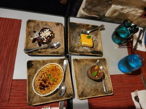 Four of their desserts (clockwise top left: brownie, cheesecake, mousse, creme brulee) at Vivo Cafe & Restaurant in West Bay