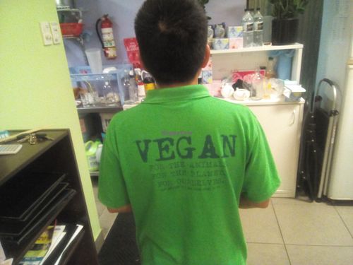 The back of the owner's shirt at Inala Vegan Restaurant in Inala