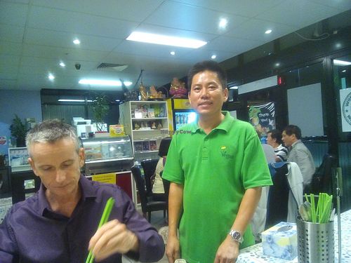 Chin, the owner, with some other guy who squeezed into the shot with his green chopsticks at Inala Vegan Restaurant in Inala