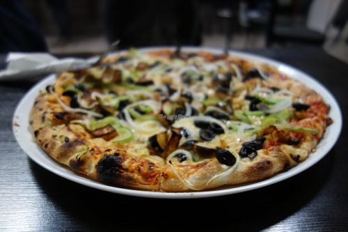 Kami Express Pizza (vegan) with falafel, aubergine, green pepper, olives, onions, and vegan cheese at Kami Express in Saarbrucken