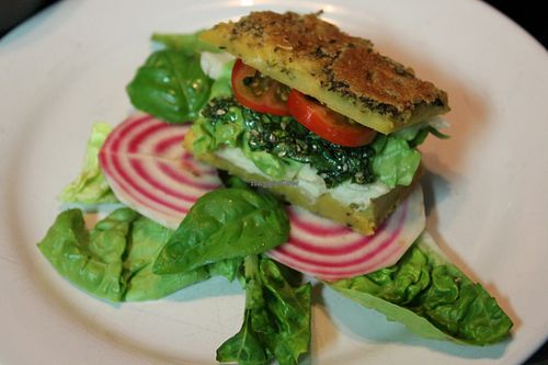 Chickpea-bread sandwich with pesto and cashew cheese. at Ficus in Oslo
