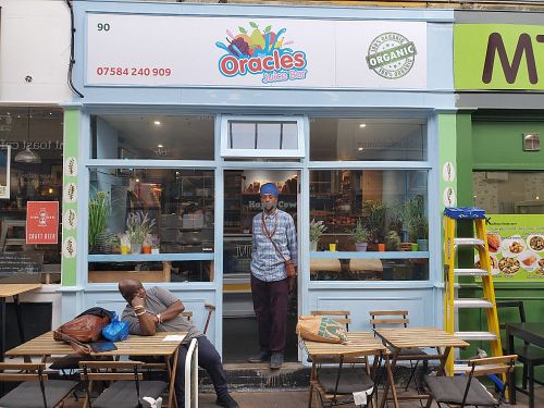 New signage with owner Ifatunde at Oracles Organic in South West London