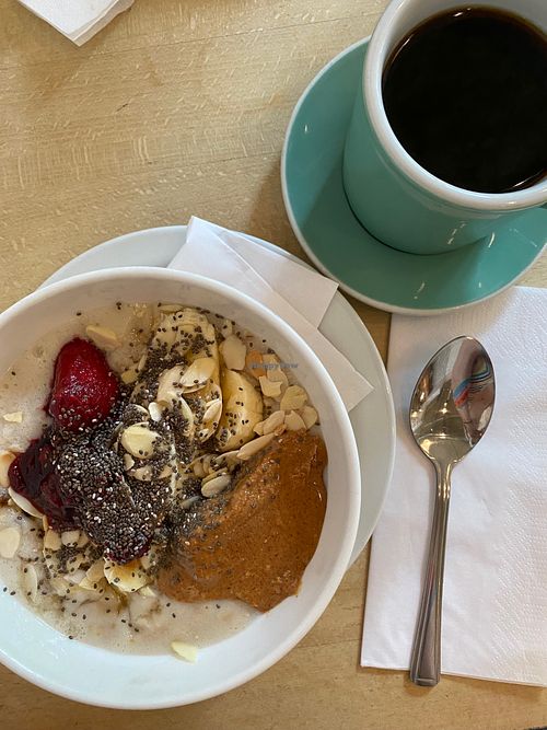 porridge with peanut butter and berry compote, and a black filter at Espresso Library in Cambridge