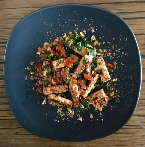 Marinated tempeh stir fried in organic coconut oil. at Alice's Restaurant  in Chiang Mai