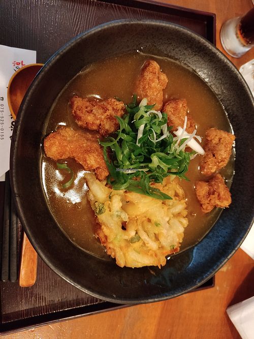 Vegetarian curry udon with soy nuggets and tempura at Mimikou in Kyoto