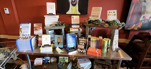 WFPB library with books for sale - took me a decade to get most of these books!!! at GreenFare Organic Cafe in Herndon