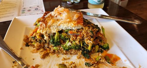 half eaten organic fried quinoa with baked tofu and vegetables. at GreenFare Organic Cafe in Herndon