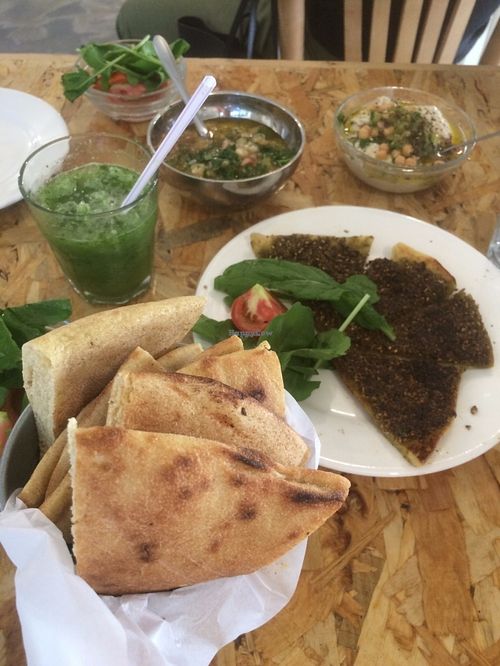 Za3tar bread, hummus, baba ghanoush and bread (and lemon & mint juice) at Shams El Balad Cafe in Amman
