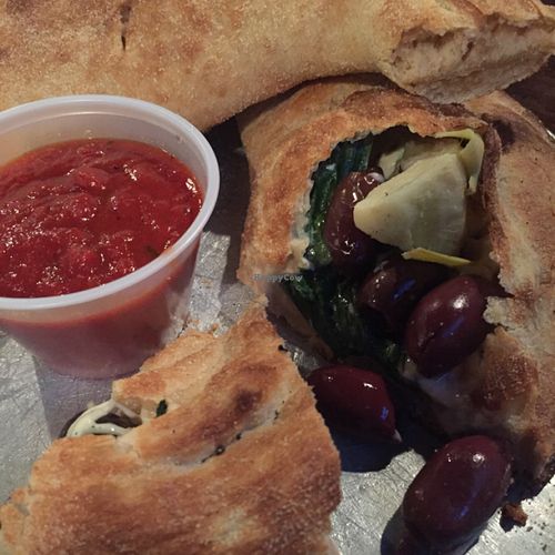 vegan calzone with spinach, greek olives & artichokes at Tomato Bar Pizza Bakery in Schererville