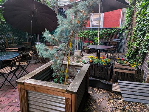 Outdoor seating in the back of Joy Cafe at Joy Cafe in Philadelphia