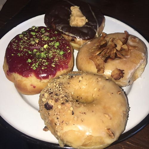 Top clockwise: Choc peanut fudge, maple smoked coconut, salted caramel hazelnut & blueberry pistachio   at Brammibal's Donuts - Maybachufer in Berlin
