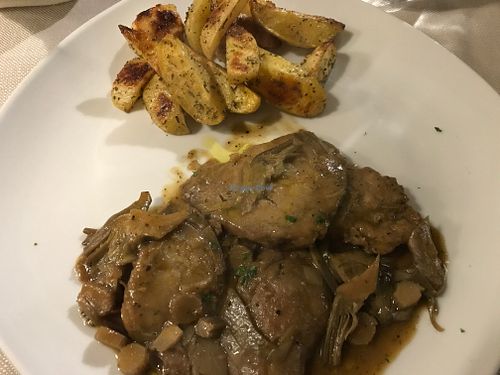 Seitan scallops with artichokes and roasted potatoes at Mezzaluna in Turin