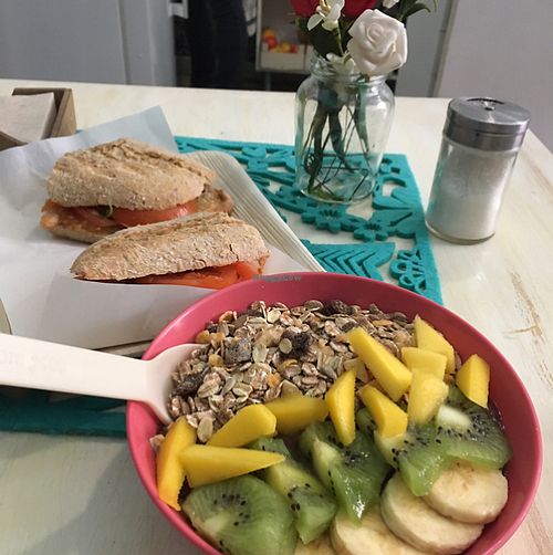 açai bowl with tomato and olive oil sandwich  at Milk Away in Sevilla