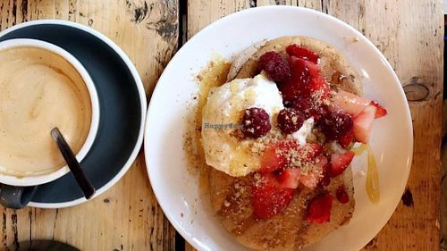 Vegan pancakes with coconut yoghurt, maple syrup, berries and a pecan crumble at Yogism - George's Street Arcade in Dublin