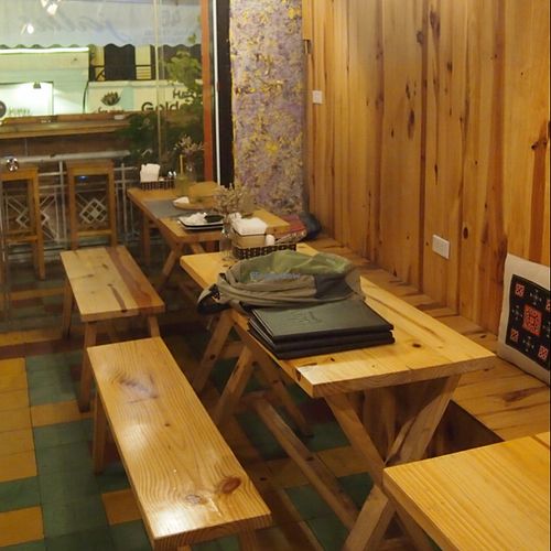 wooden seating area at Jalus Vegan Kitchen in Hanoi