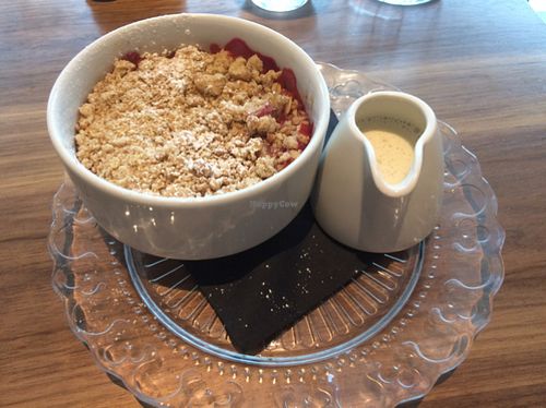 crumble of the day (rasberry) with home made custard  at Mildreds - Camden in North West London